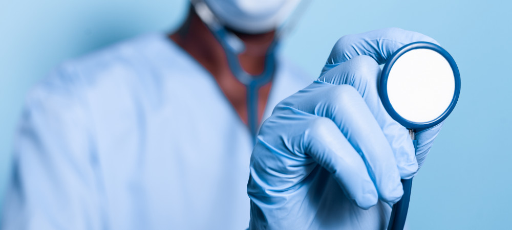 Close up of african american hand holding stethoscope
